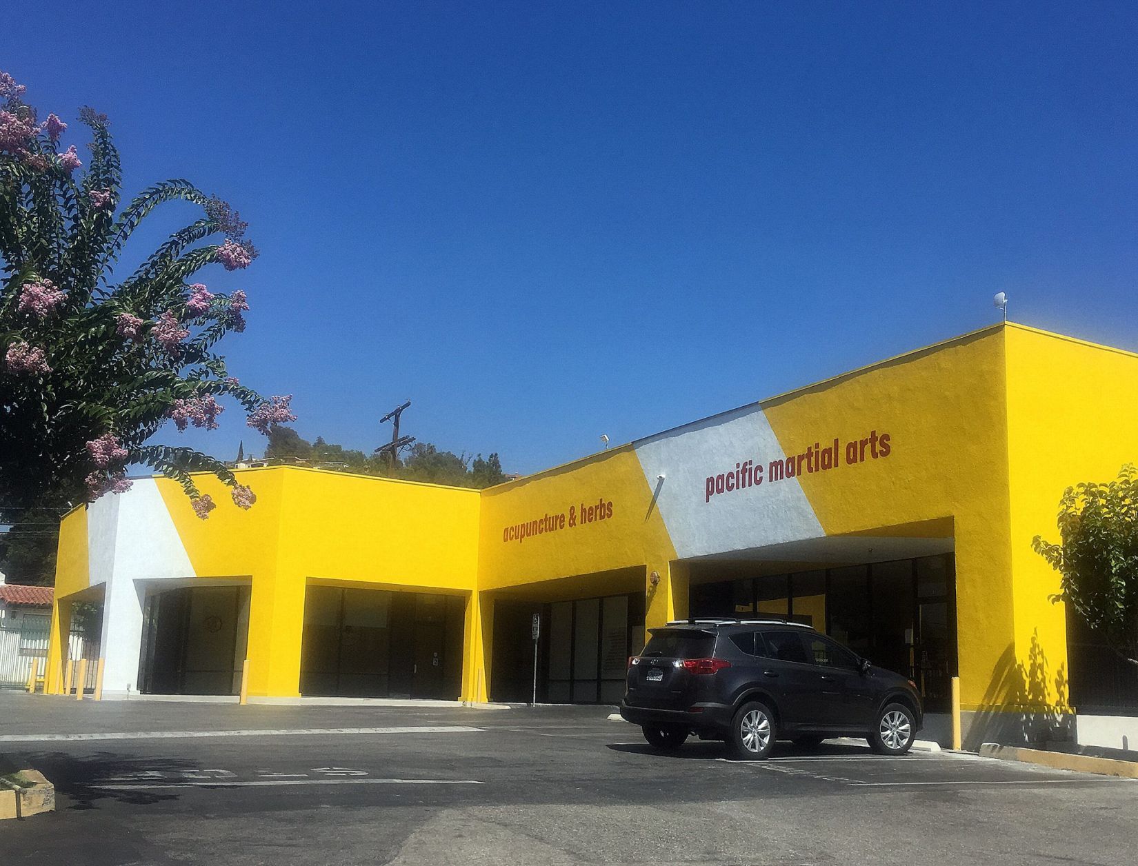 Yellow and white Verdugo Plaza buildings